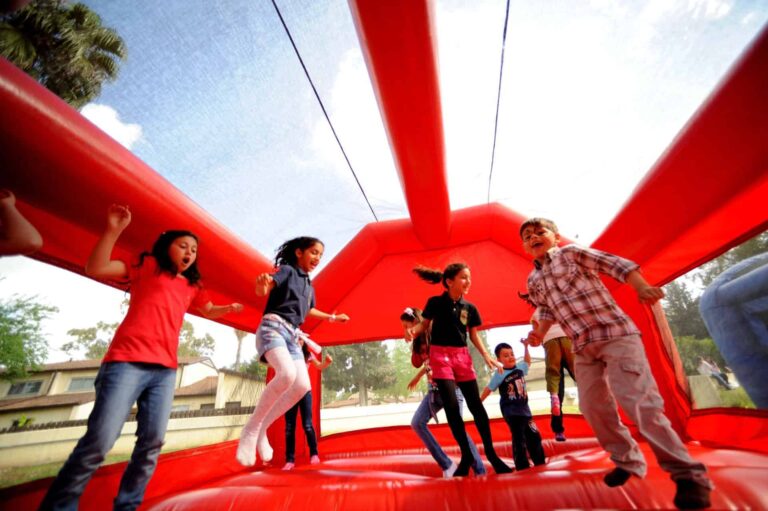 Kids playing inside a bounce house rental in Erie, CO during a party