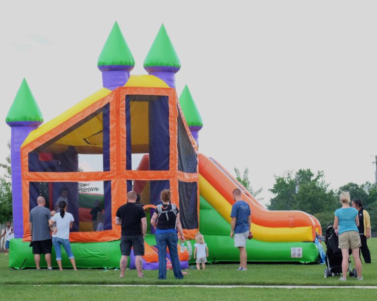Family enjoying colorful bounce house rental in Fort Collins CO
